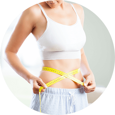Thin woman with a measuring tape wrapped around her waist