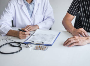 A male doctor is consulting with a male patient about testosterone.