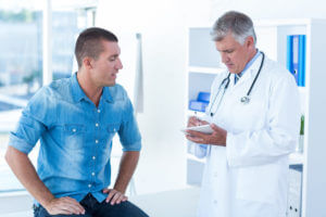A doctor is recommending testosterone therapy for men as a treatment for his patient.