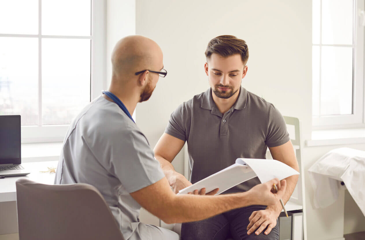 Young man patient visiting a doctor at the office for testosterone therapy for men.