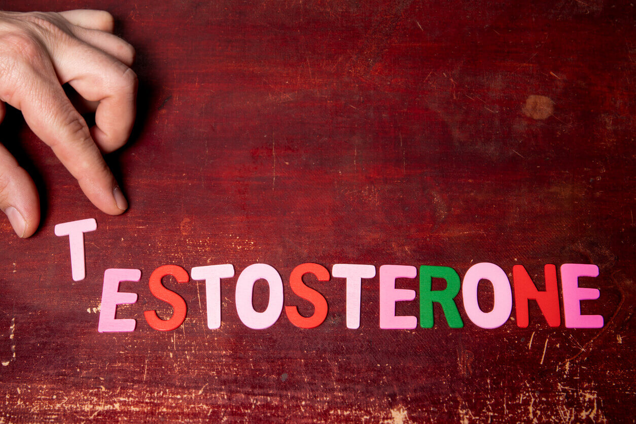 TESTOSTERONE Colored text on a painted wooden background.